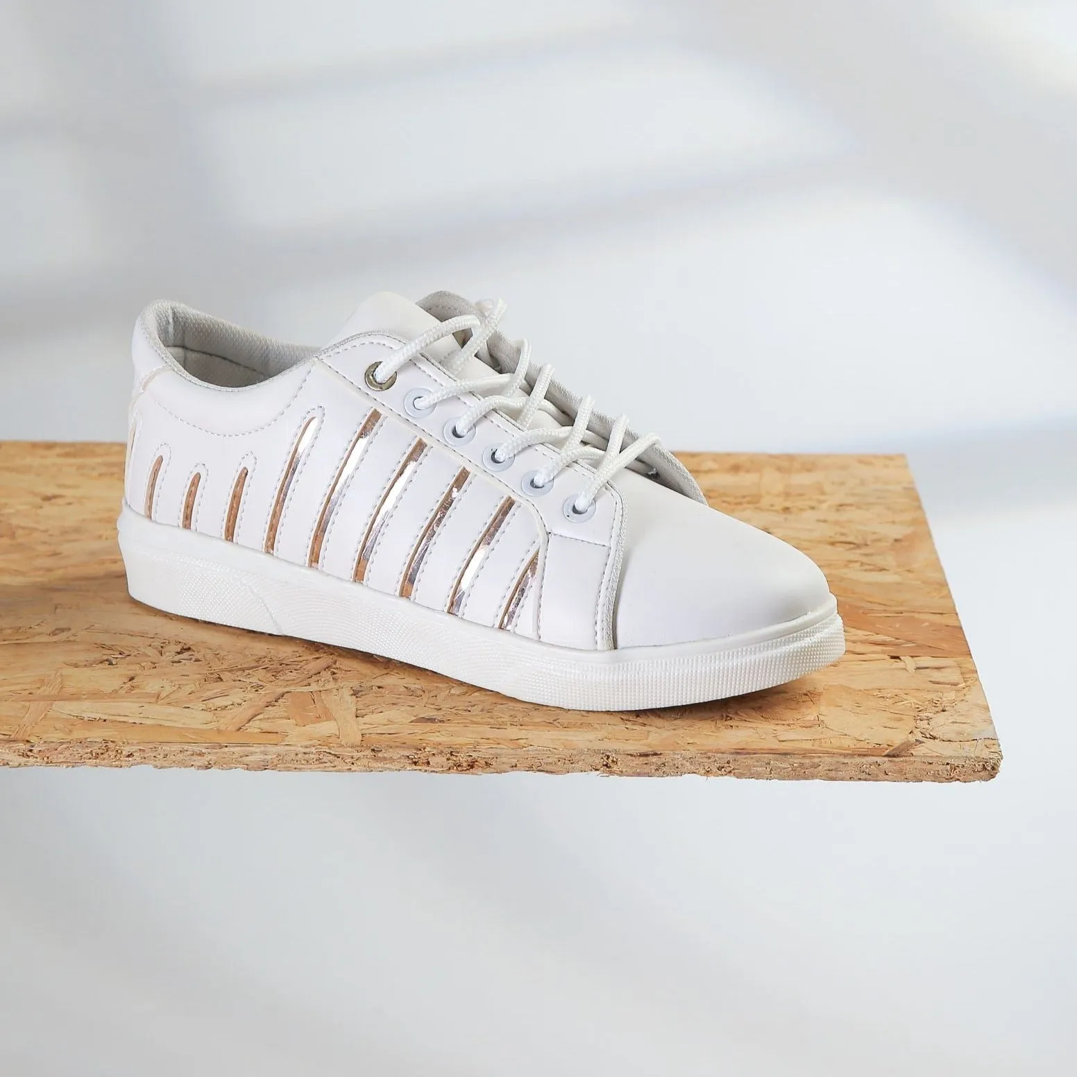 white sneaker with Gold lines